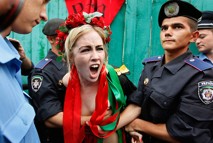 24 hours in pictures: Ukrainian policemen arrest members of female political activist group FEMEN