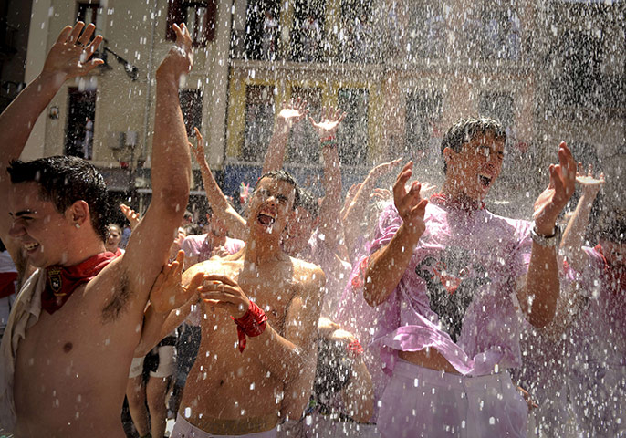 Pamplona revellers: Participants get wet during the Chupinazo at the San Fermin Festival