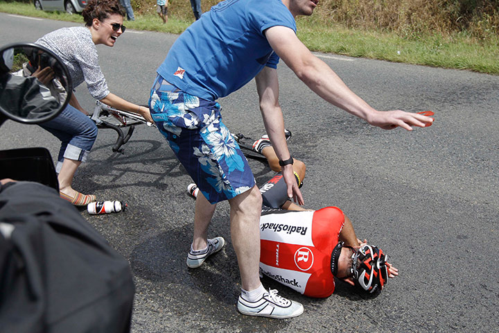 Tour de France stage 5: Spectators come to the aid of Janez Brajkovic after he crashed
