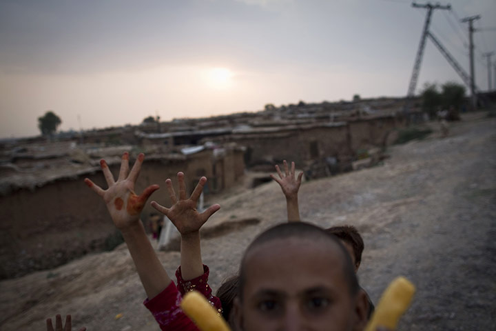 24 hours in pictures: Children play in Islamabad, Pakistan