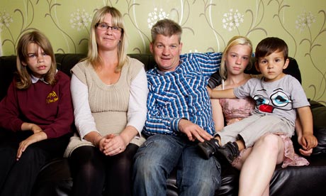 Young grandmother Jayne Fox with her family at home in Rotherham.