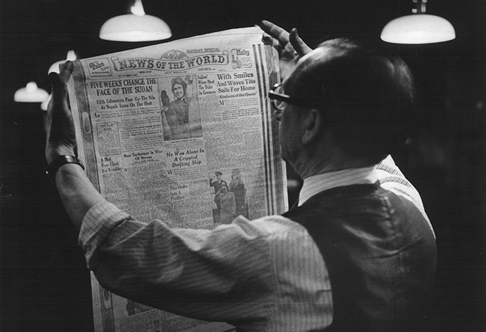 News of The World History: A printer studies a front page proof at the News of The World