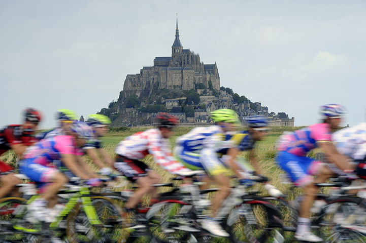Tour de France Stage 6: The peloton rides past the rocky tidal island of Mont Saint-Michel