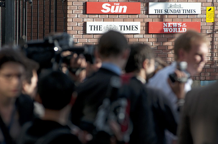 News of the World Update: Press gather outside the News of the world offices in Wapping