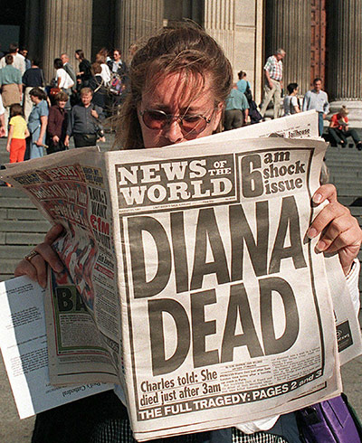 News of the World Update: A woman reading about the death of Diana in the News of The World
