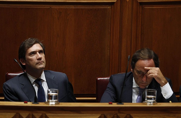 Week In Business: Portugal's credit rating slashed to junk