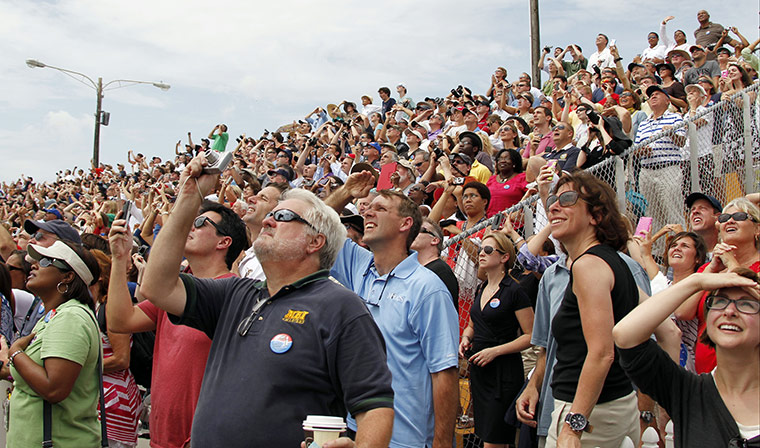 Shuttle Final Launch: Spectators watch the space shuttle Atlantis lift off from the Space Center