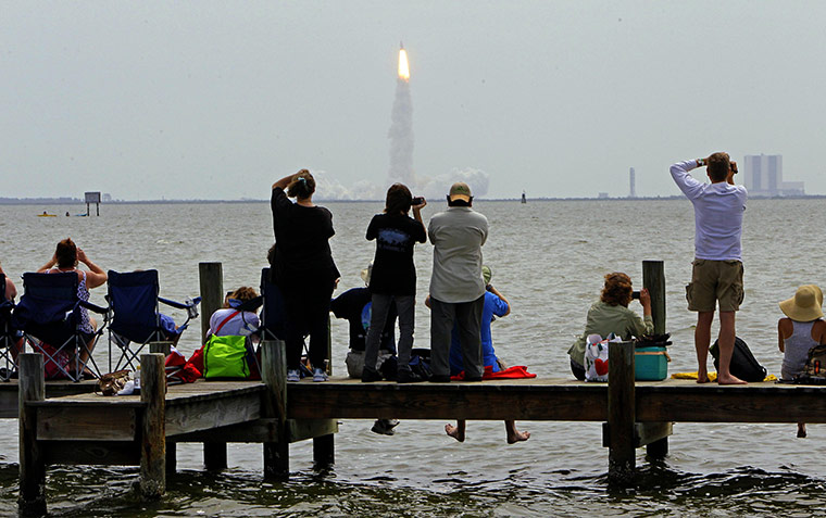 Shuttle Final Launch: Spectators watch the final launch of shuttle Atlantis in Titusville, Fla.