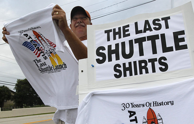 Shuttle Final Launch: Jeff Eaton of Cocoa Beach, Fla., sells t-shirts along A1A shuttle launch
