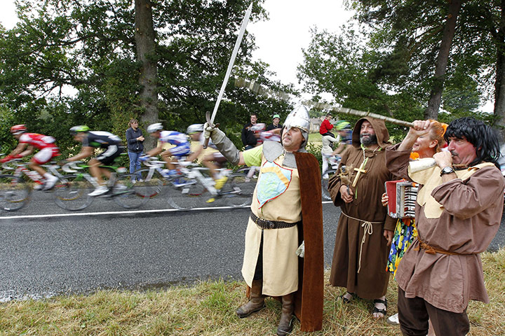 Tour De France stage 8: Medieval attired fans cheer on the breakaway leaders