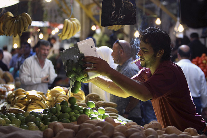 24 hours: Amman, Jordan: A vendor arranges limes before Ramadan