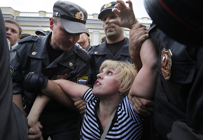 24 hours: St Petersburg, Russia: Police officers detain an opposition activist
