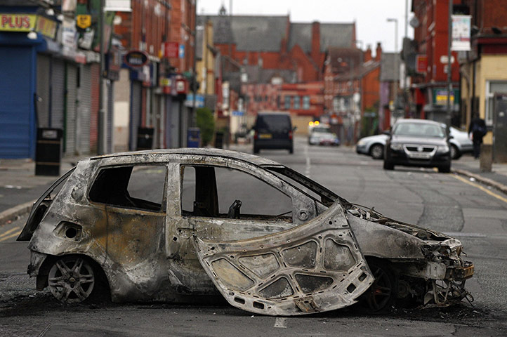 UK Riots: A burnt out car in Toxteth, Liverpool