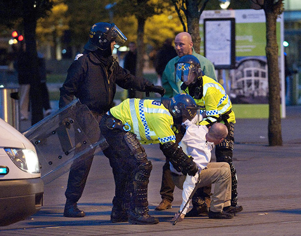 UK Riots: A rioter is arrested by police in Manchester