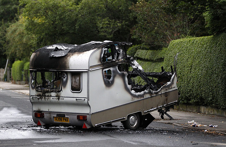 UK Riots: A burnt out caravan in Toxteth, Liverpool