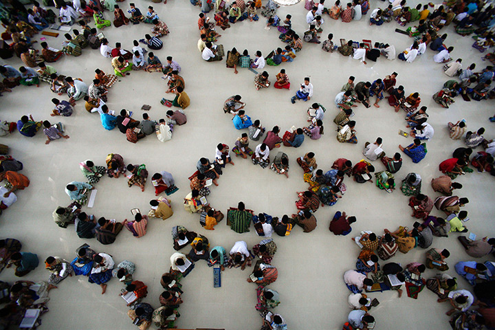 24 hours in pictures: Students attend a Qur'an recitation class, Indonesia