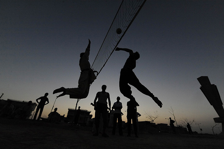24 hours in pictures: Afghan boys play volleyball in the city of Mazar-i-Sharif