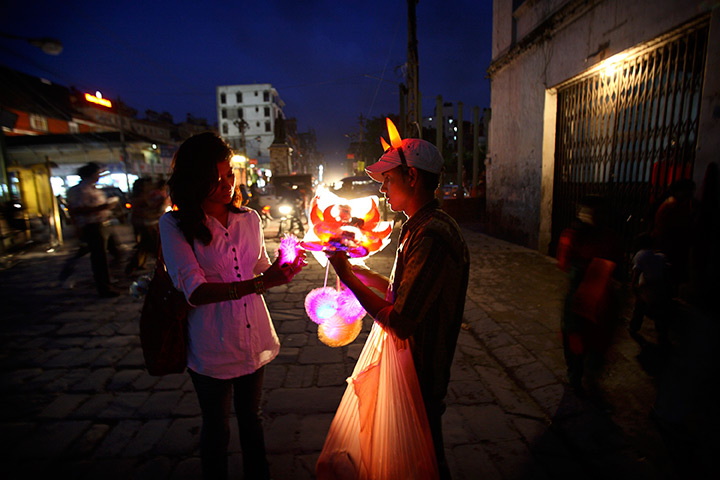 24 hours in pictures: A Nepalese street vendor selling toys in Kathmandu