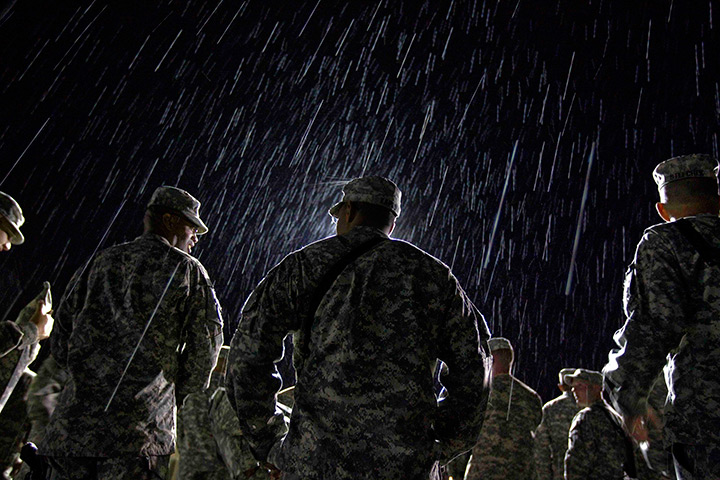 24 hours in pictures: US Army's 4th Brigade Combat Team stand in the rain, Kyrgyzstan