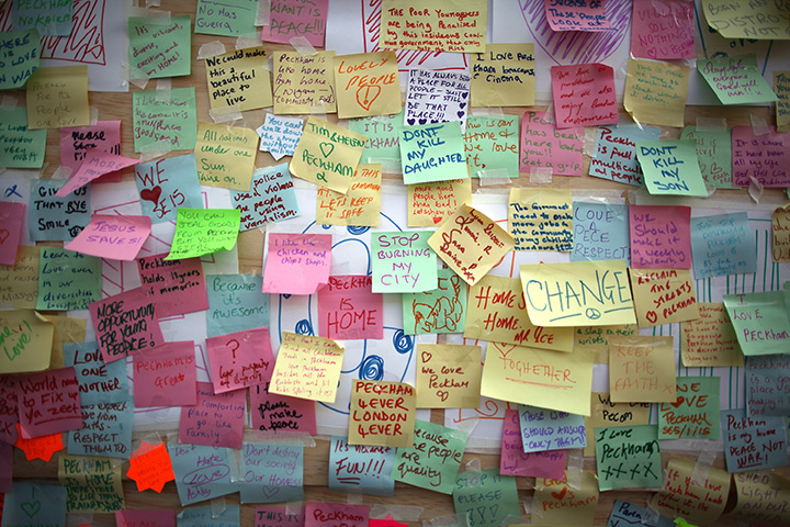 24 hours in pictures: Store in Peckham carries notes of peace after the riots around the UK