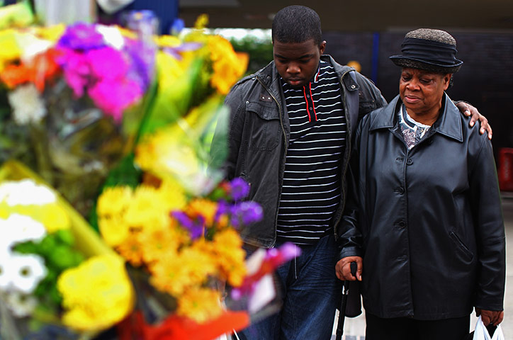 London riots aftermath: Members of the Winson Green community at the scene of a hit and run