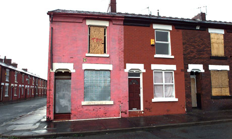 Derelict boarded up terraced housing in Manchester.