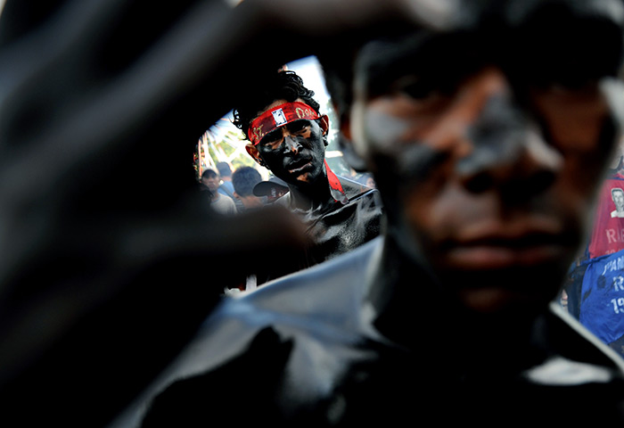 24 hours in pictures: Believers with bodies painted at the festival of Managua's patron saint