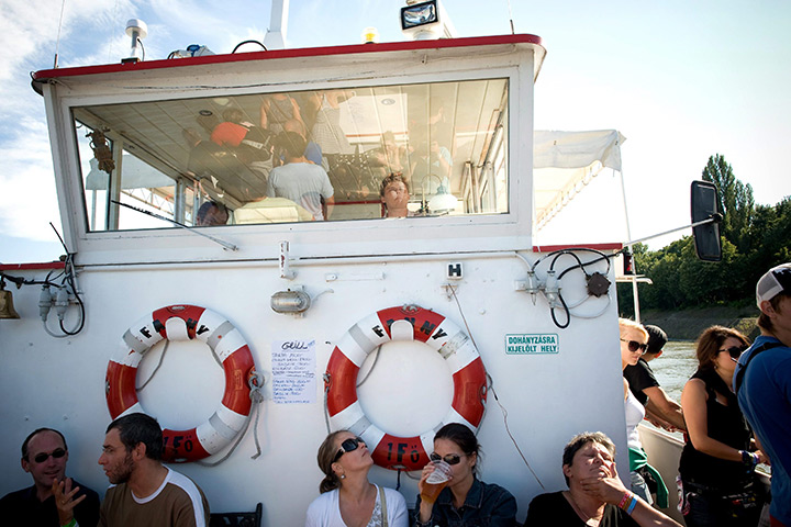 24 hours in pictures: Festival-goers travel on board a ship at Sziget Festival 2011