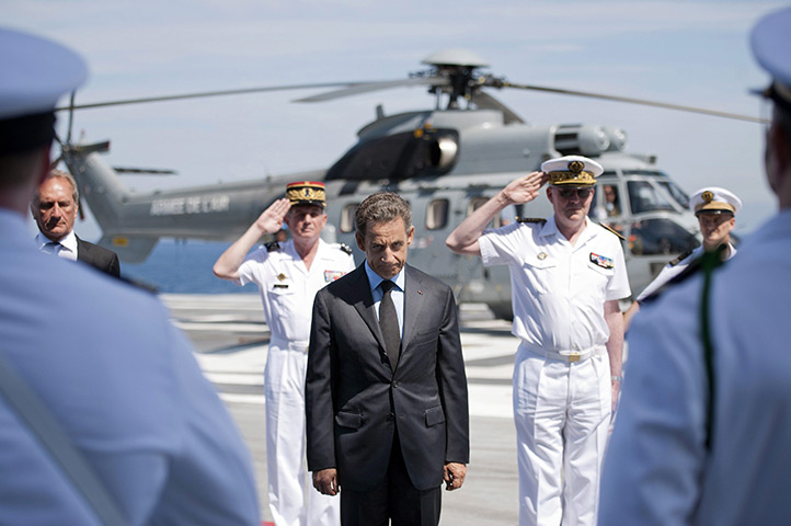 24 hours in pictures: President Nicolas Sarkozy reviews troops on deck of the aircraft carrier