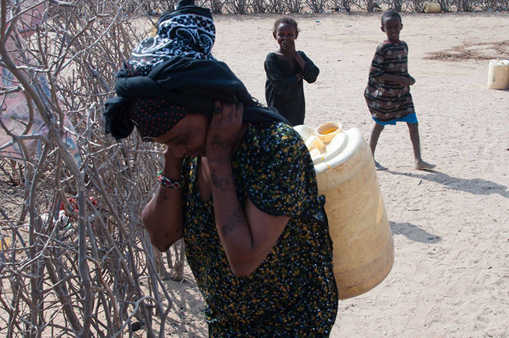 MDG Farmers case studies: Asna Hamo with son Yasin 