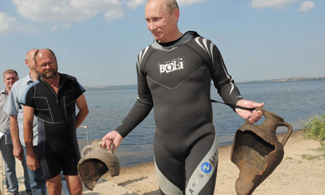 Vladimir Putin carries his archaelogical trophies from a dive in the Black Sea