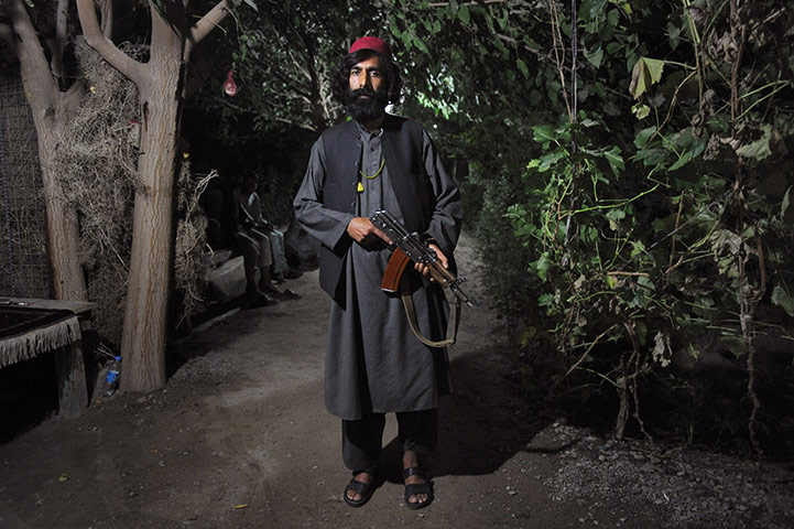 24 Hours: -Afghan warlord Haji Tor Gani poses with his Russian assault rifle