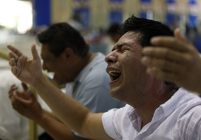 24 hours in pictures: Guadalajara, Mexico: Devotees of the Light of the World Church pray