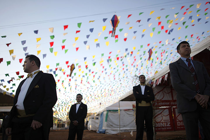 24 hours in pictures: Brasilia, Brazil: Grooms arrive at the start of a mass wedding