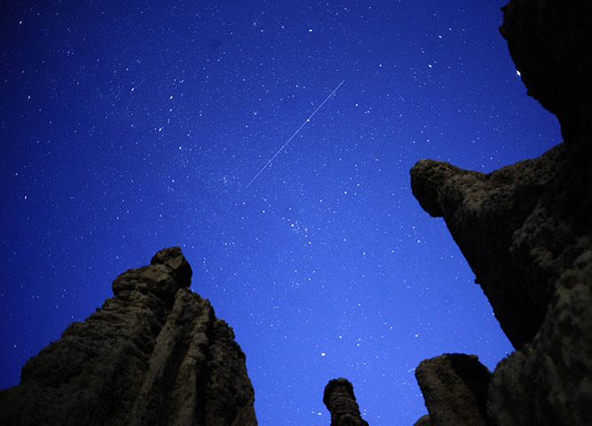 24 hours in pictures: Kuklici, Macedonia: A meteor streaks past stars