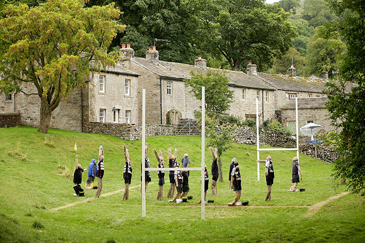 24 hours in pictures: Kettlewell, England: Scarecrows as rugby players at a festival