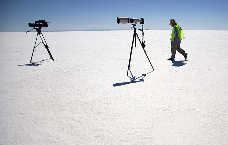 24 hours in pictures: Bonneville Salt Flats, Utah, USA: A man walks to his video camera