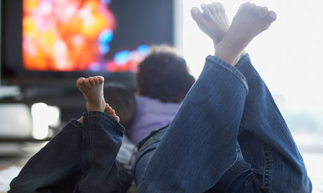 Mother and son watching television