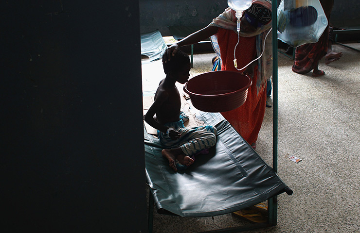 24 hours in pictures: Mother aids her daughter at the Banadir hospital, Somalia