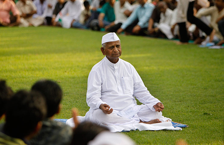 Anna Hazare : Anna Hazare sits in a meditative posture at Rajghat, New Delhi