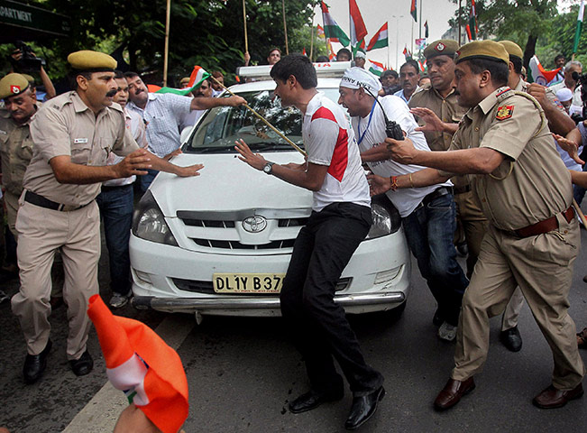 Anna Hazare : Supporters try to stop the car carrying Indian rights activist Anna Hazare