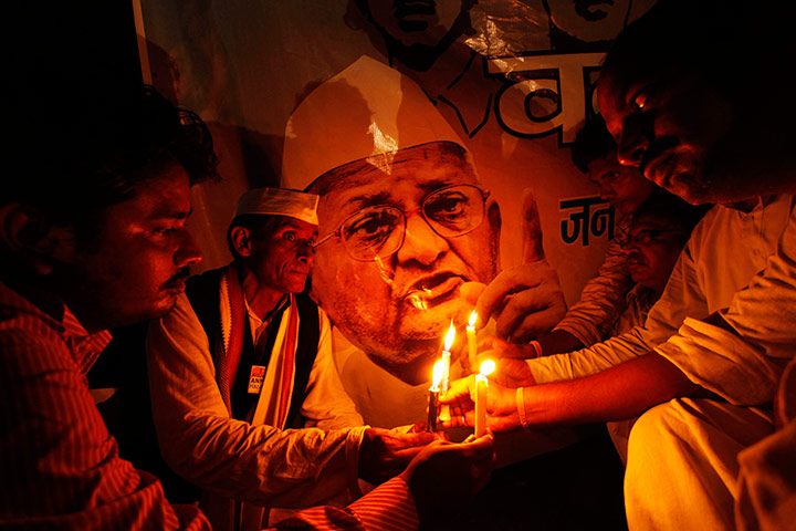 Anna Hazare : Supporters Anna Hazare hold a candlelight vigil in Allahabad