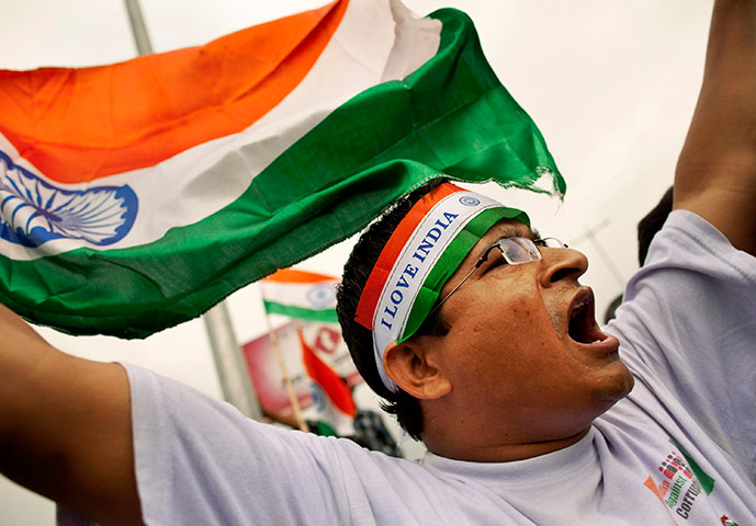 Anna Hazare : A supporter Anna Hazare shouts slogans after Hazare was detained, New Delhi