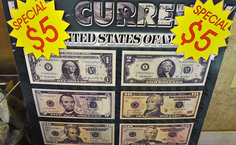 Week in Business: Dollar poster at the Bureau of Engraving and Printing in Washington 