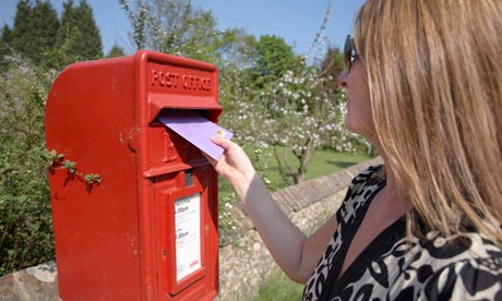 Woman posting a letter