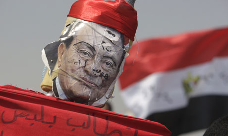 A defaced image of former Egyptian president Hosni Mubarak