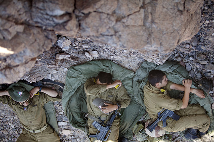24 hours in pictures: Israeli army troops rest on the Israeli - Egyptian border