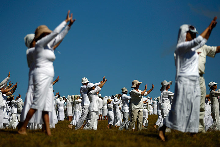 24 hours in pictures: Members of the White Brotherhood perform a ritual dance near Babreka lake