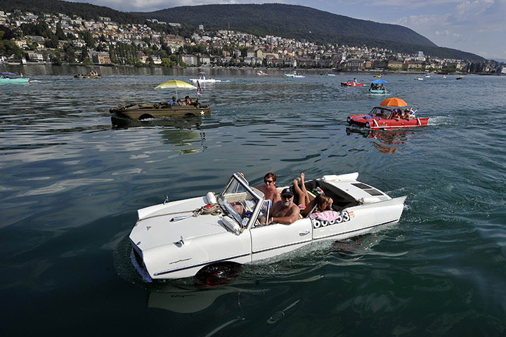 24 hours in pictures: Amphibious cars motor across Lake Neuchatel 