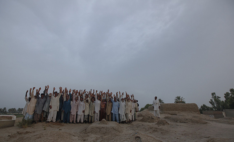 FTA: Adrees Latif   : A posed portrait of residents from the same village one year later
